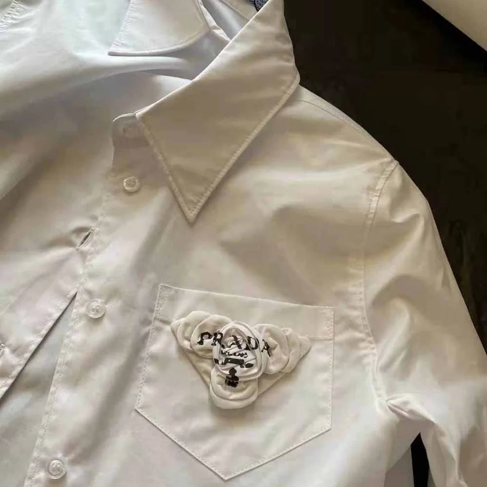 Prada Poplin Shirt Reveals a Complex Simplicity Constantly for Women Prada Poplin Shirt Reveals a Complex Simplicity Constantly for Women