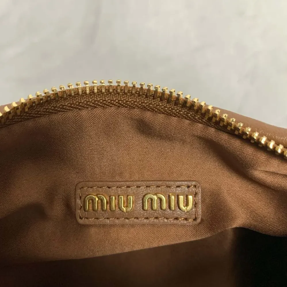 Miu Miu Wander Matelassé Nappa Leather Bag for Women in Brown/White Miu Miu Wander Matelassé Nappa Leather Bag for Women in Brown/White