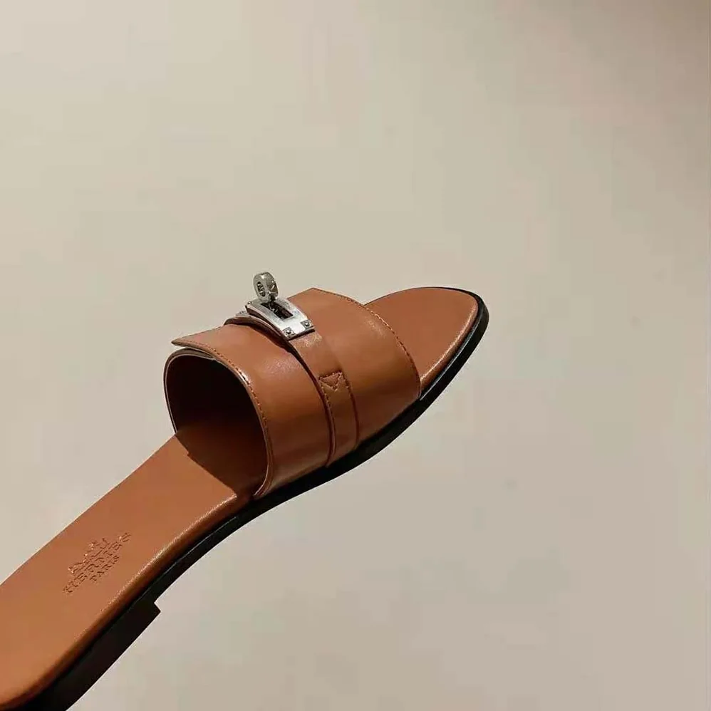 Hermes Giulia Sandal in Calfskin with Iconic Palladium-Plated Kelly Buckle for Women in Brown Hermes Giulia Sandal in Calfskin with Iconic Palladium-Plated Kelly Buckle for Women in Brown