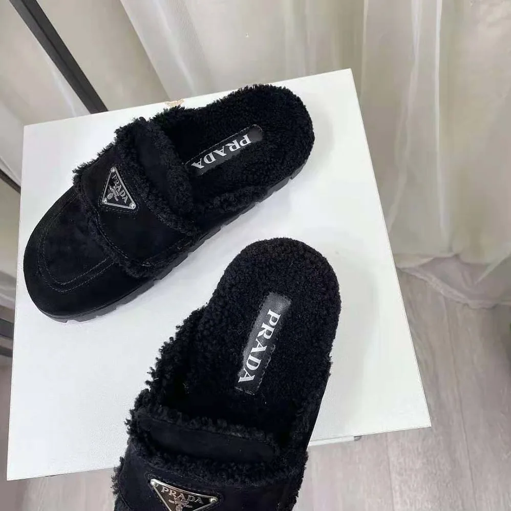 Prada Shearling Slippers Enameled Metal Triangle Logo for Women in Black