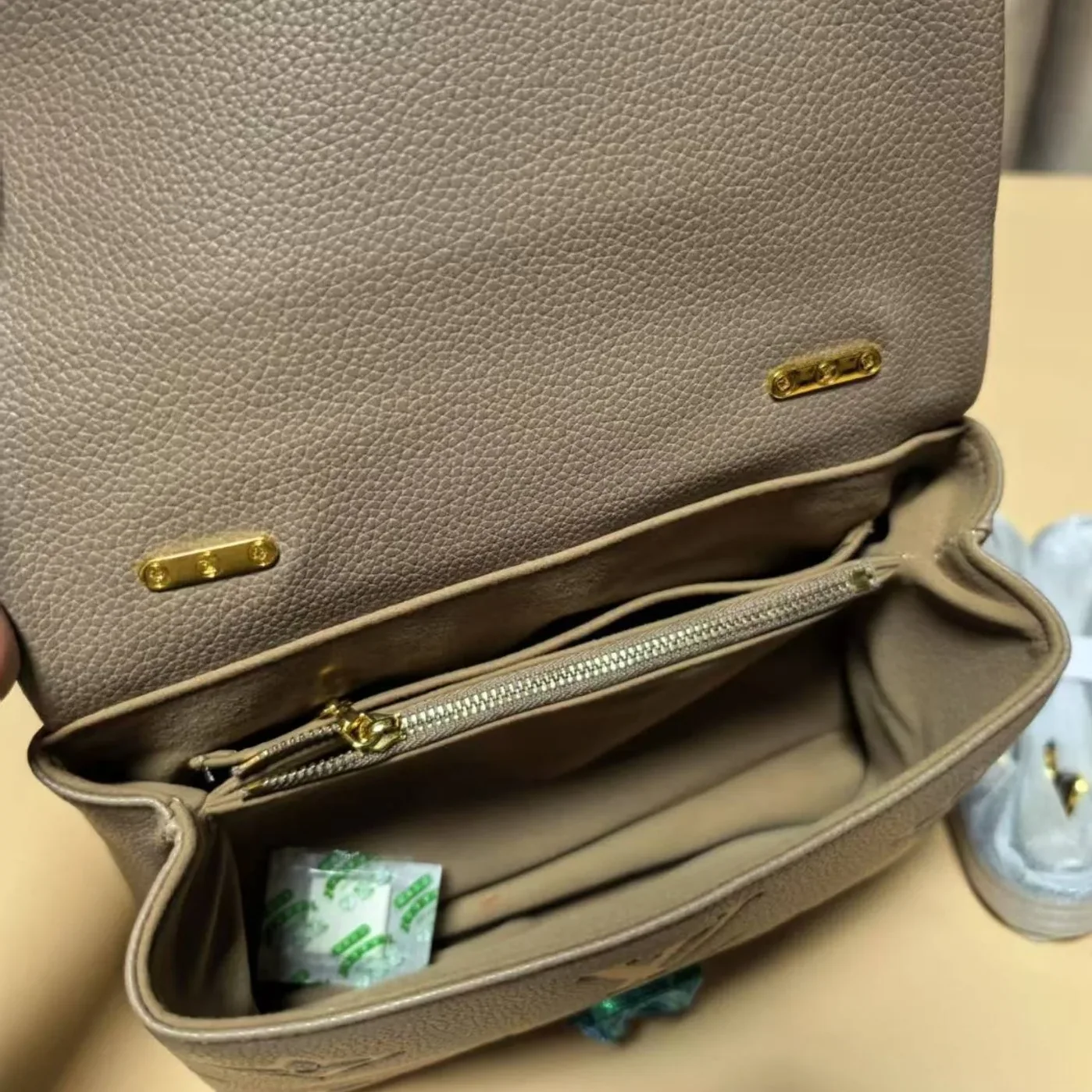 Louis Vuitton Madeleine BB Monogram Empreinte Dove Gray in Creme Beige
