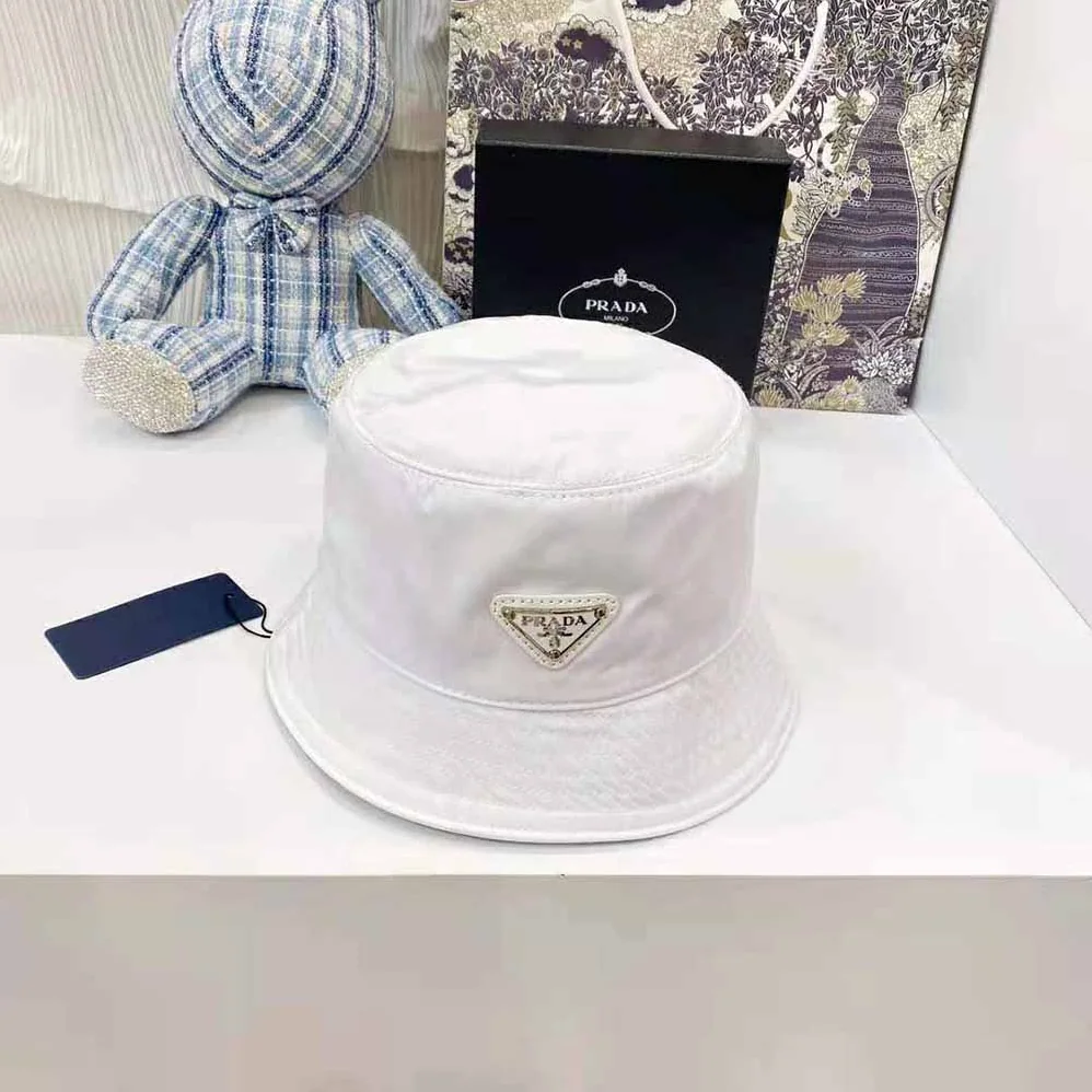 Prada Nylon Bucket Hat Decorated with the Triangle Logo for Women in White Prada Nylon Bucket Hat Decorated with the Triangle Logo for Women in White