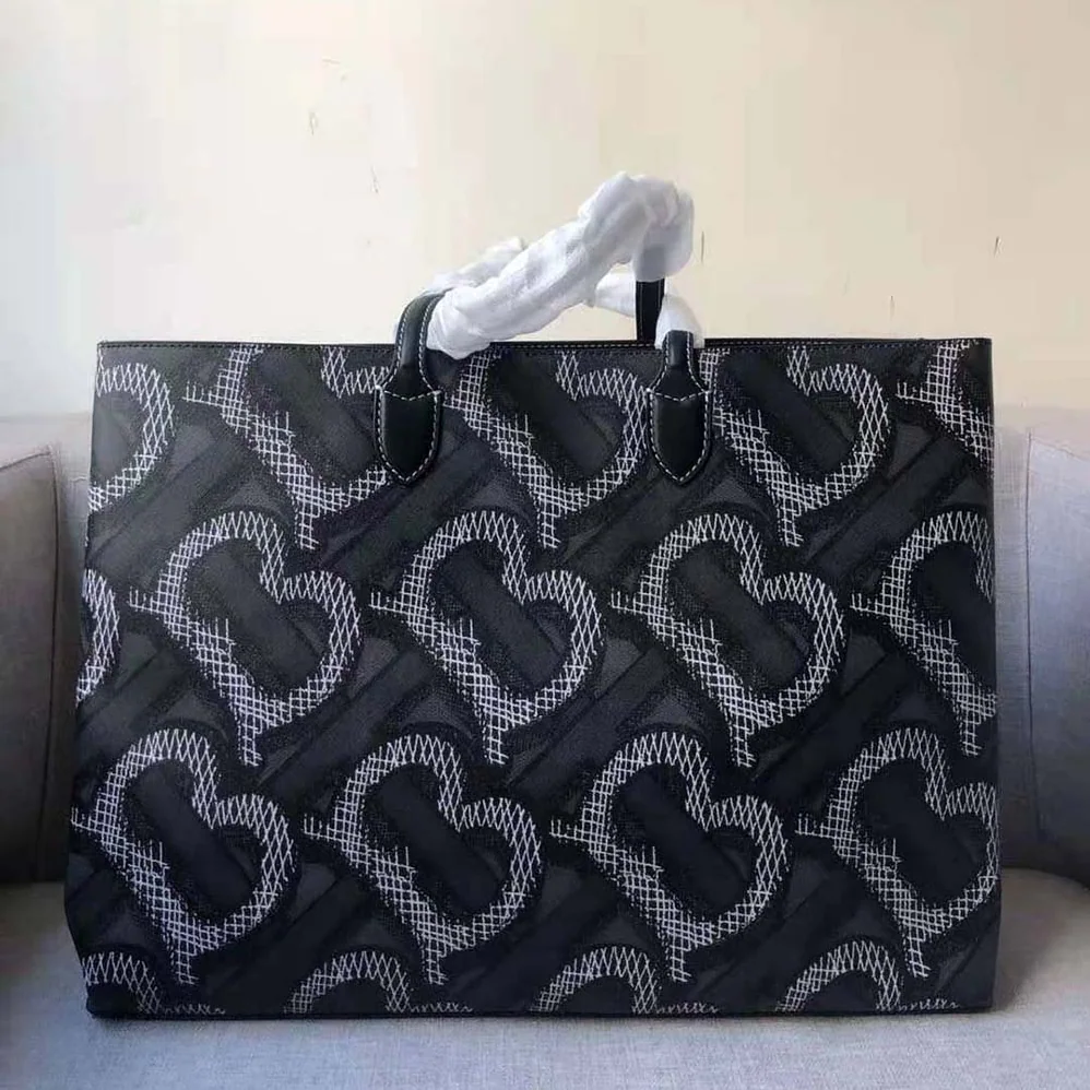 Burberry Monogram Print E-canvas Tote Bag for Women in Black Burberry Monogram Print E-canvas Tote Bag for Women in Black