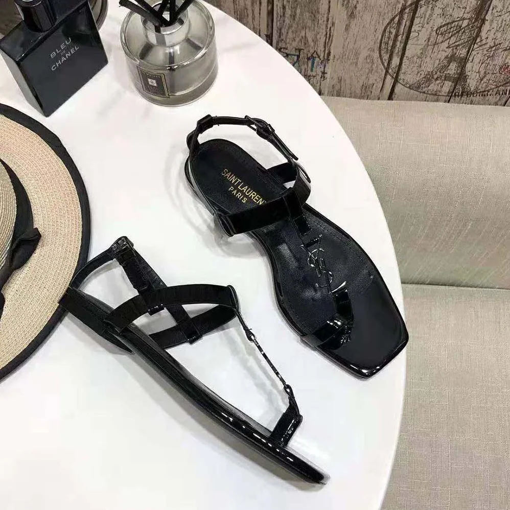 Saint Laurent YSL Cassandra Flat Sandals in Patent Leather with Silver for Women in Tone Monogram
