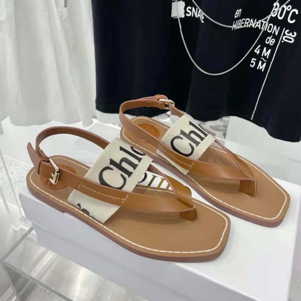 Chloe Woody Flat Sandal in Calfskin and Canvas for Women in White Chloe Woody Flat Sandal in Calfskin and Canvas for Women in White