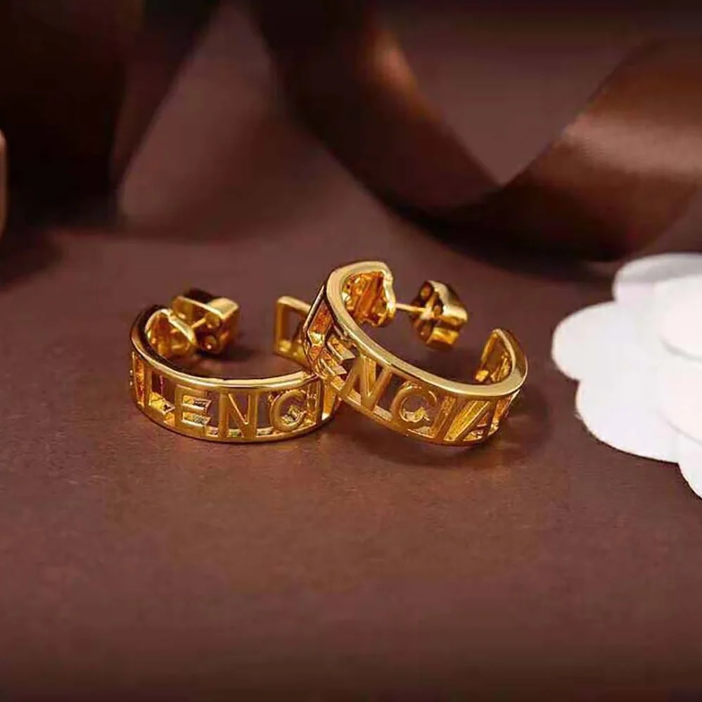 Balenciaga Logo Earrings in Gold Brass for Women