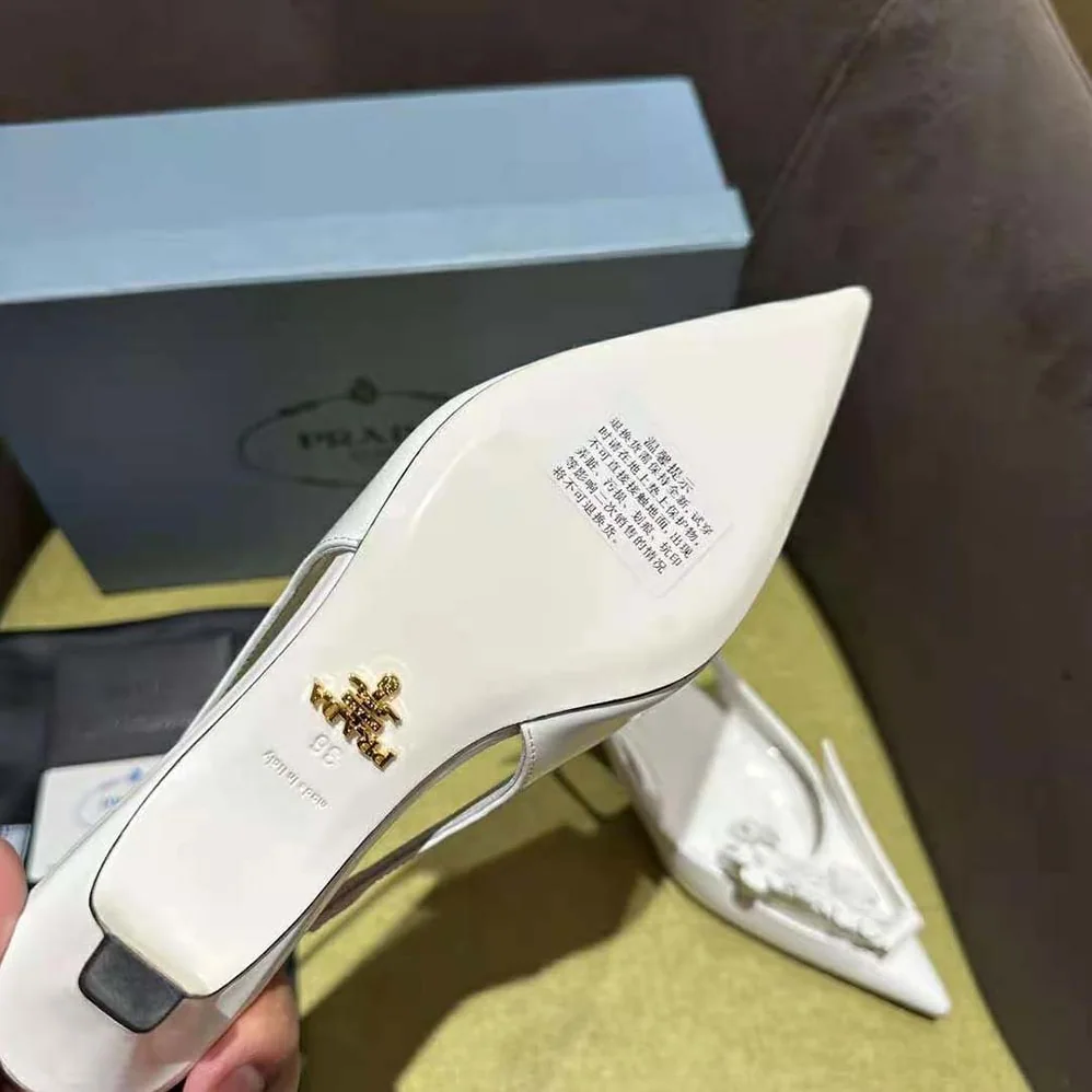 Prada Brushed Leather Slingback Pumps with Floral Appliques for Women in White Prada Brushed Leather Slingback Pumps with Floral Appliques for Women in White