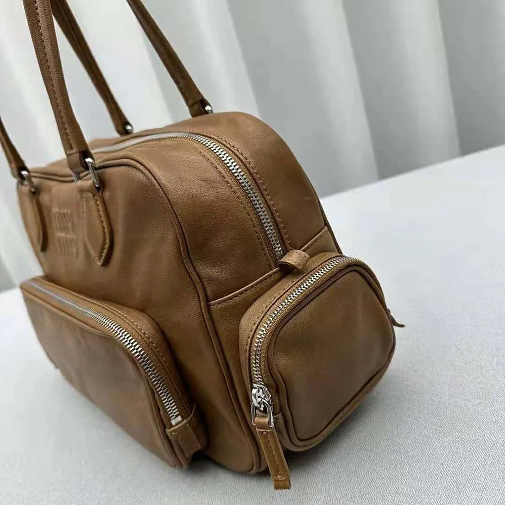 Miu Miu Nappa Leather Top-handle Bag with Embossed Lettering Logo for Women in Brown