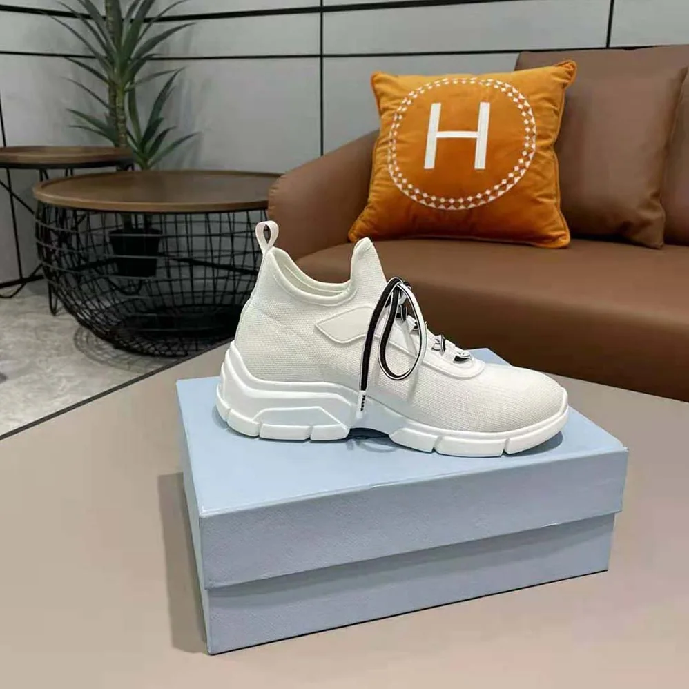 Prada The Triangle Logo Decorates These Knit Fabric Sneakers for Women in White Prada The Triangle Logo Decorates These Knit Fabric Sneakers for Women in White