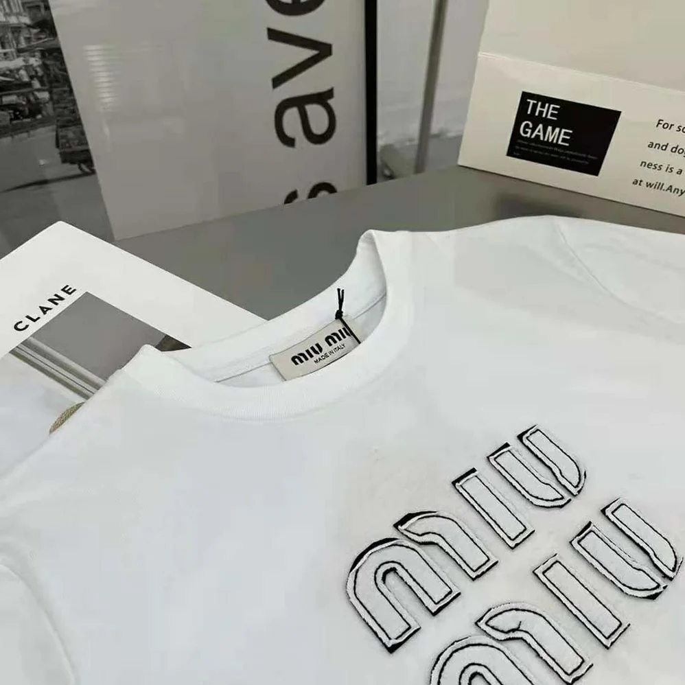Miu Miu Embroidered Cotton T-shirt with Embroidered Logo for Women in White Miu Miu Embroidered Cotton T-shirt with Embroidered Logo for Women in White