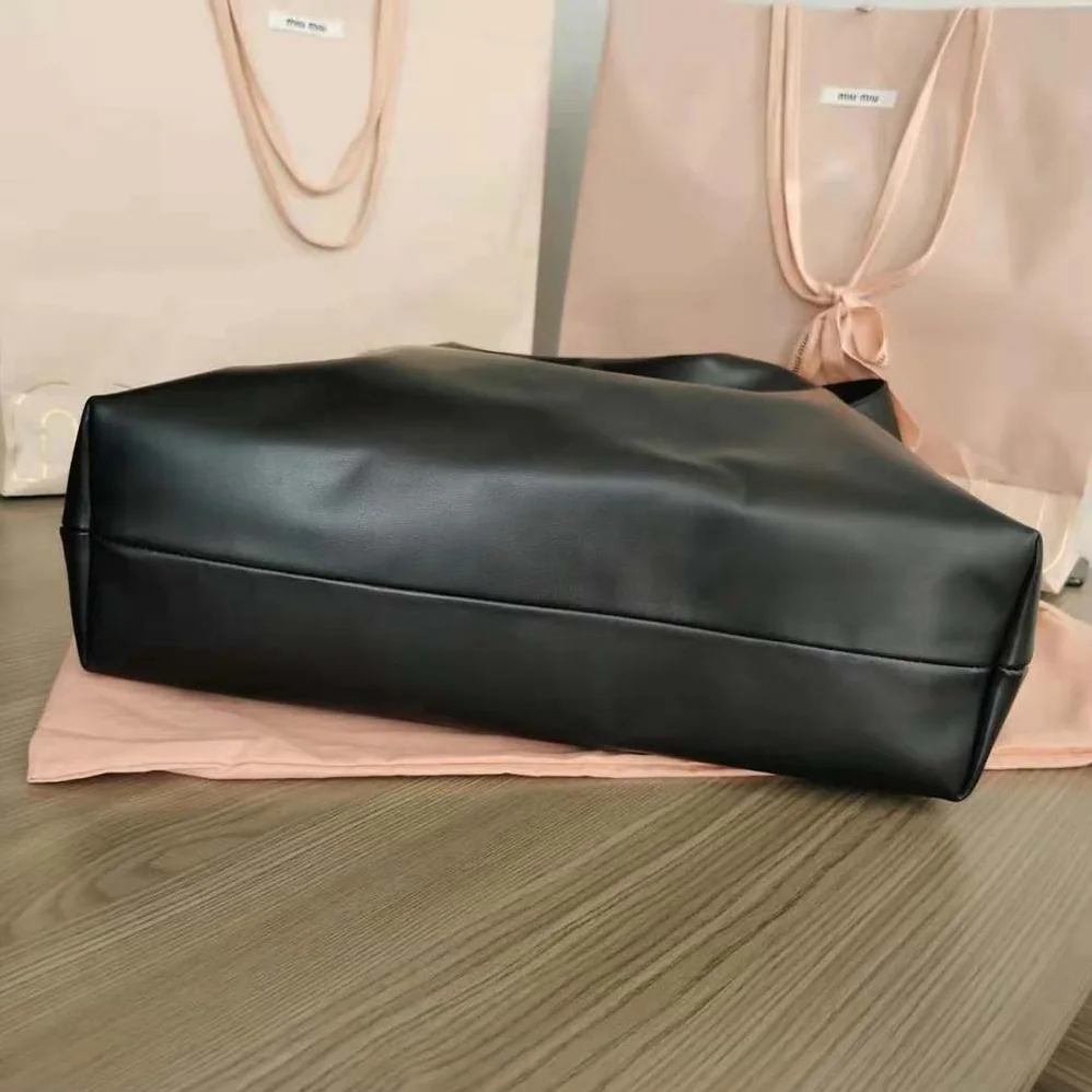 Miu Miu Leather Shoulder Bag with Embossed Lettering Logo on the Front for Women
