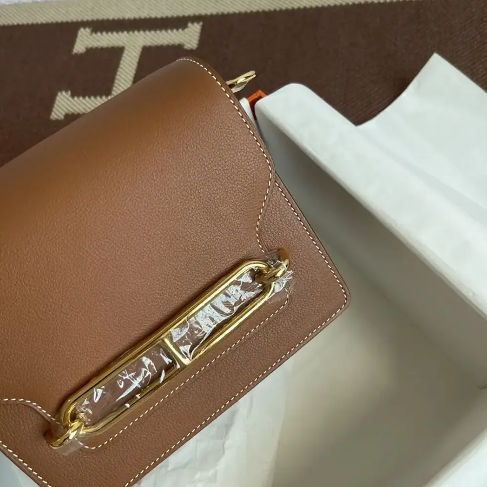 Hermes Roulis Mini Bag in Evercolor Calfskin for Women in Brown/Gold Hermes Roulis Mini Bag in Evercolor Calfskin for Women in Brown/Gold