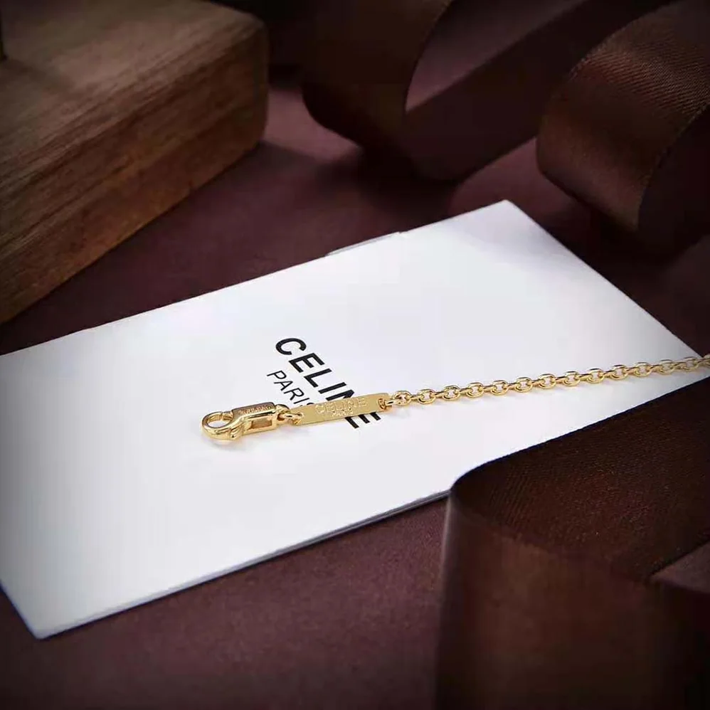 Celine Cœur Celine Charms Necklace in Brass with Gold Finish and Resin Pearl for Women Celine Cœur Celine Charms Necklace in Brass with Gold Finish and Resin Pearl for Women