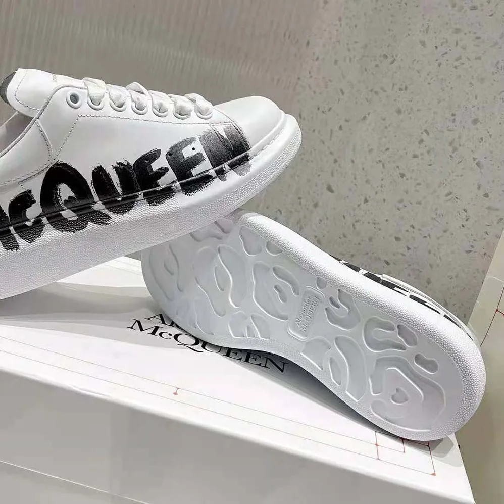 Alexander Mcqueen Online Exclusive Mcqueen Graffiti Oversized Sneaker in White for Unisex in black Alexander Mcqueen Online Exclusive Mcqueen Graffiti Oversized Sneaker in White for Unisex in black