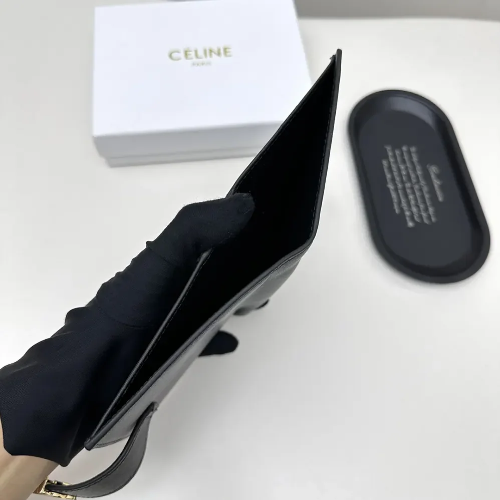 Celine Medium Strap Wallet Nino in Supple Grained Calfskin for Women in Black Celine Medium Strap Wallet Nino in Supple Grained Calfskin for Women in Black