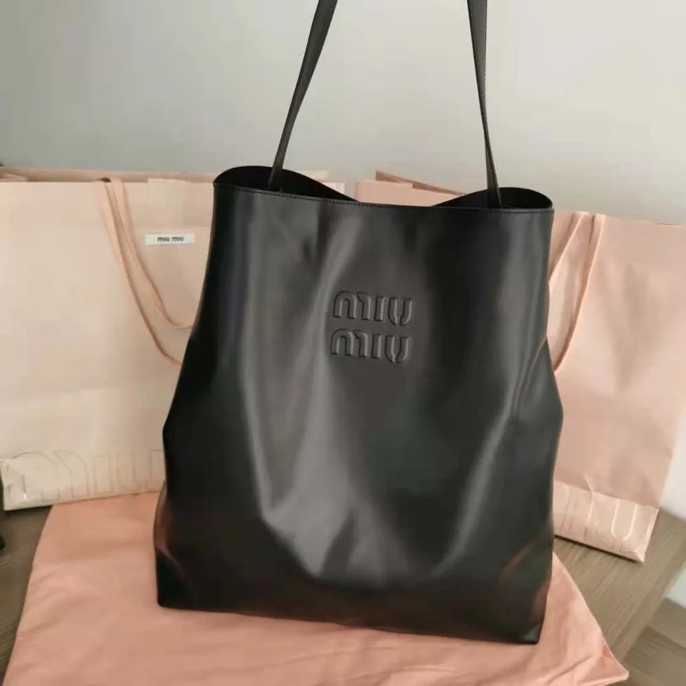 Miu Miu Leather Shoulder Bag with Embossed Lettering Logo on the Front for Women