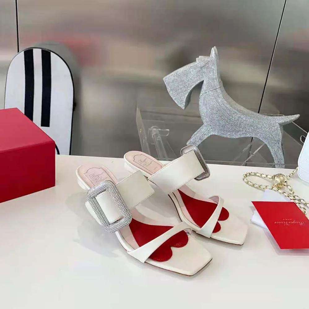 Roger Vivier Viv Choc Side Strass Buckle Mules in Leather for Women in White