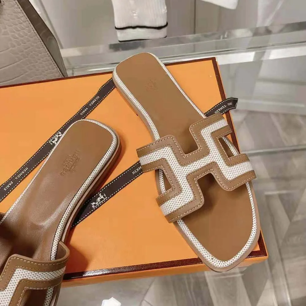 Hermes Oran Sandal in Calfskin and H Canvas with Iconic H Cut for Women in Out Hermes Oran Sandal in Calfskin and H Canvas with Iconic H Cut for Women in Out