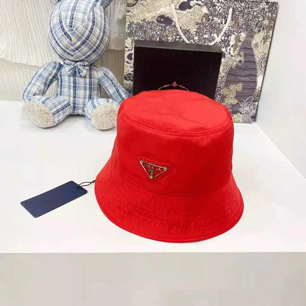 Prada Nylon Bucket Hat Decorated with the Triangle Logo for Women in Red