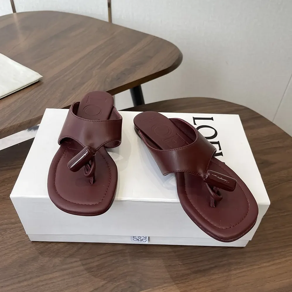 Loewe Toggle Flat Sandal in Shiny Smoot Calfskin for Women in Burnt Red Loewe Toggle Flat Sandal in Shiny Smoot Calfskin for Women in Burnt Red