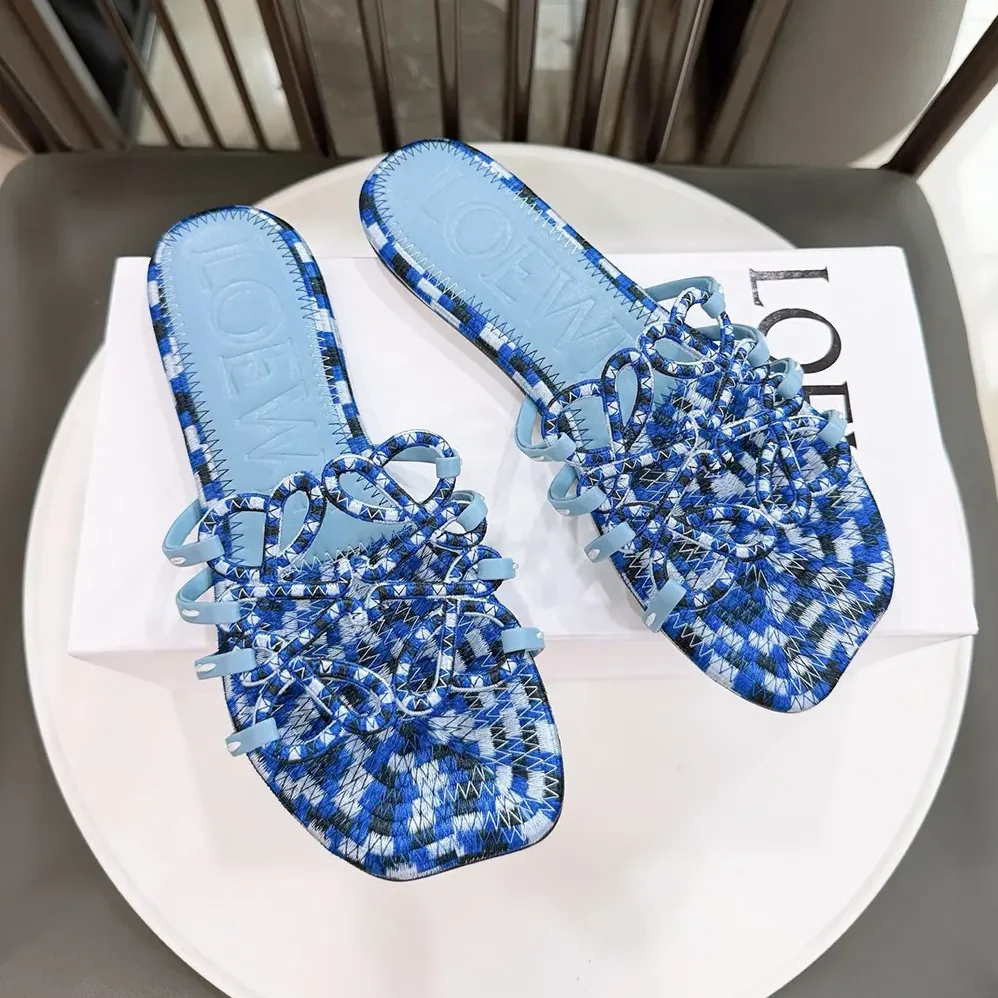 Loewe Petal Anagram Slide in Embroidered Canvas for Women in Baby Blue Loewe Petal Anagram Slide in Embroidered Canvas for Women in Baby Blue