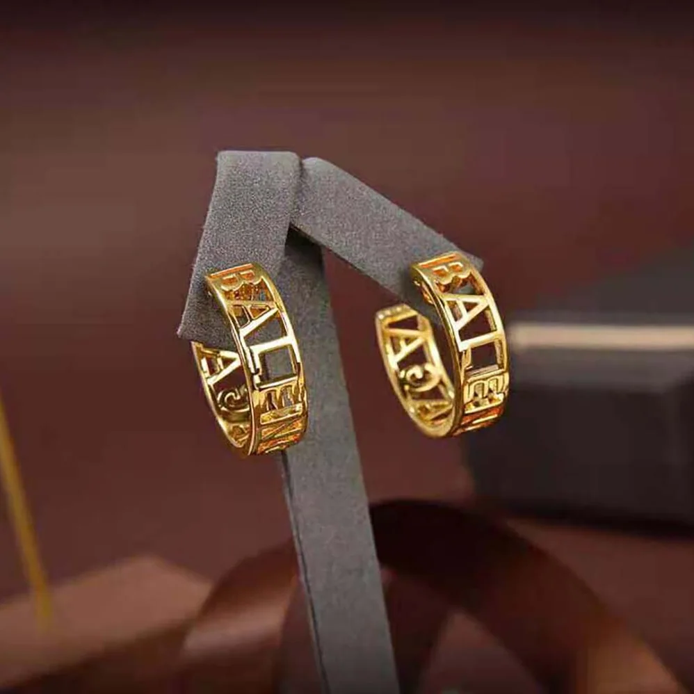 Balenciaga Logo Earrings in Gold Brass for Women