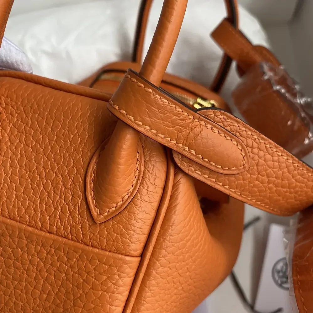 Hermes Lindy Mini 19 in Clemence Leather for Women in Orange/Gold Hermes Lindy Mini 19 in Clemence Leather for Women in Orange/Gold