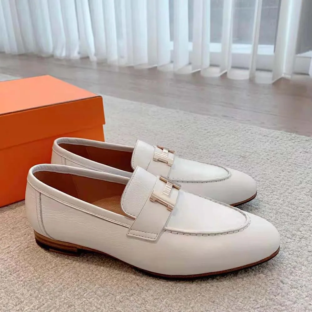 Hermes Paris Loafer in Calfskin with Palladium Plated Signature “H” Detail for Women in White Hermes Paris Loafer in Calfskin with Palladium Plated Signature “H” Detail for Women in White