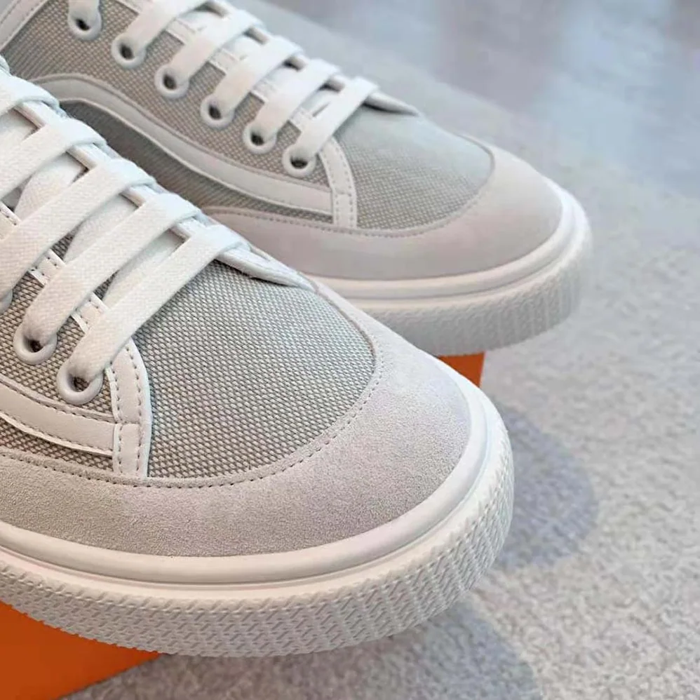 Hermes Get Sneaker in SH Canvas and Calfskin with Signature “Hermès Paris” Stencil for Unisex in Silver Hermes Get Sneaker in SH Canvas and Calfskin with Signature “Hermès Paris” Stencil for Unisex in Silver