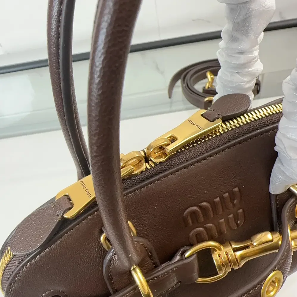 Miu Miu Aventure Nappa Leather Top-handle Bag for Women in Bordeaux Miu Miu Aventure Nappa Leather Top-handle Bag for Women in Bordeaux