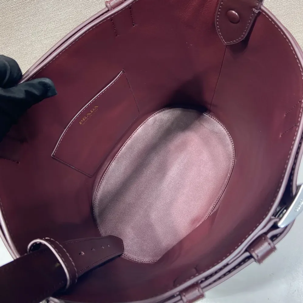 Prada Buckle Belted Suede Bucket Bag for Women in Burgundy Prada Buckle Belted Suede Bucket Bag for Women in Burgundy