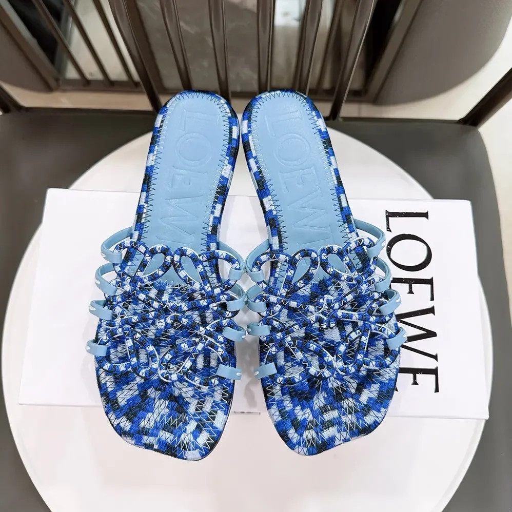 Loewe Petal Anagram Slide in Embroidered Canvas for Women in Baby Blue Loewe Petal Anagram Slide in Embroidered Canvas for Women in Baby Blue