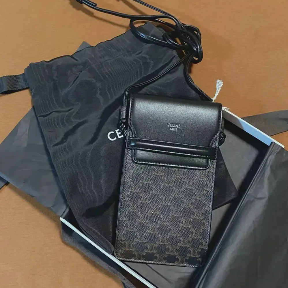 Celine Phone Pouch with Flap in Triomphe Canvas and Lambskin for Women in Black Celine Phone Pouch with Flap in Triomphe Canvas and Lambskin for Women in Black