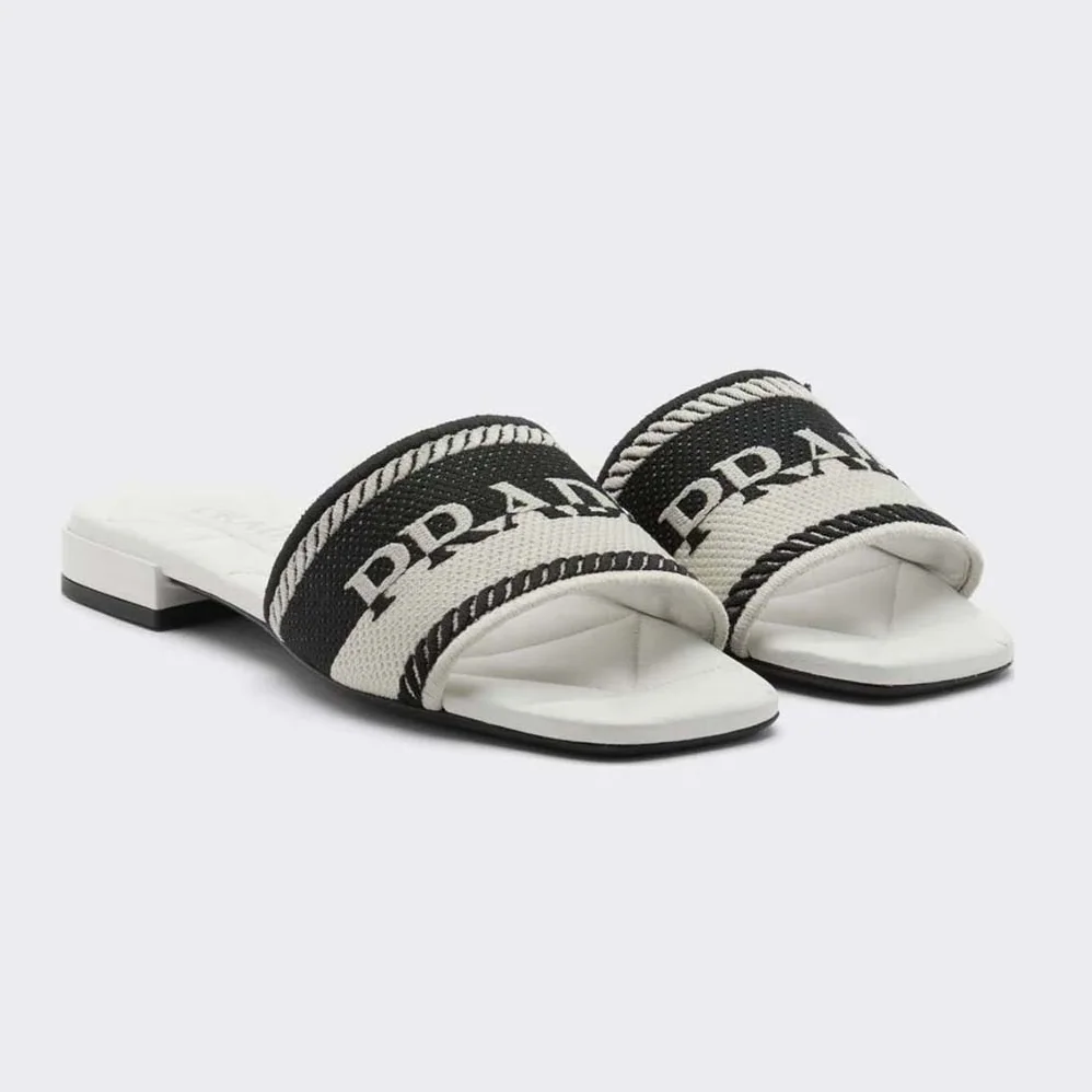 Prada Embroidered Fabric Slides With Embroidered Lettering Logo for Women in White Prada Embroidered Fabric Slides With Embroidered Lettering Logo for Women in White