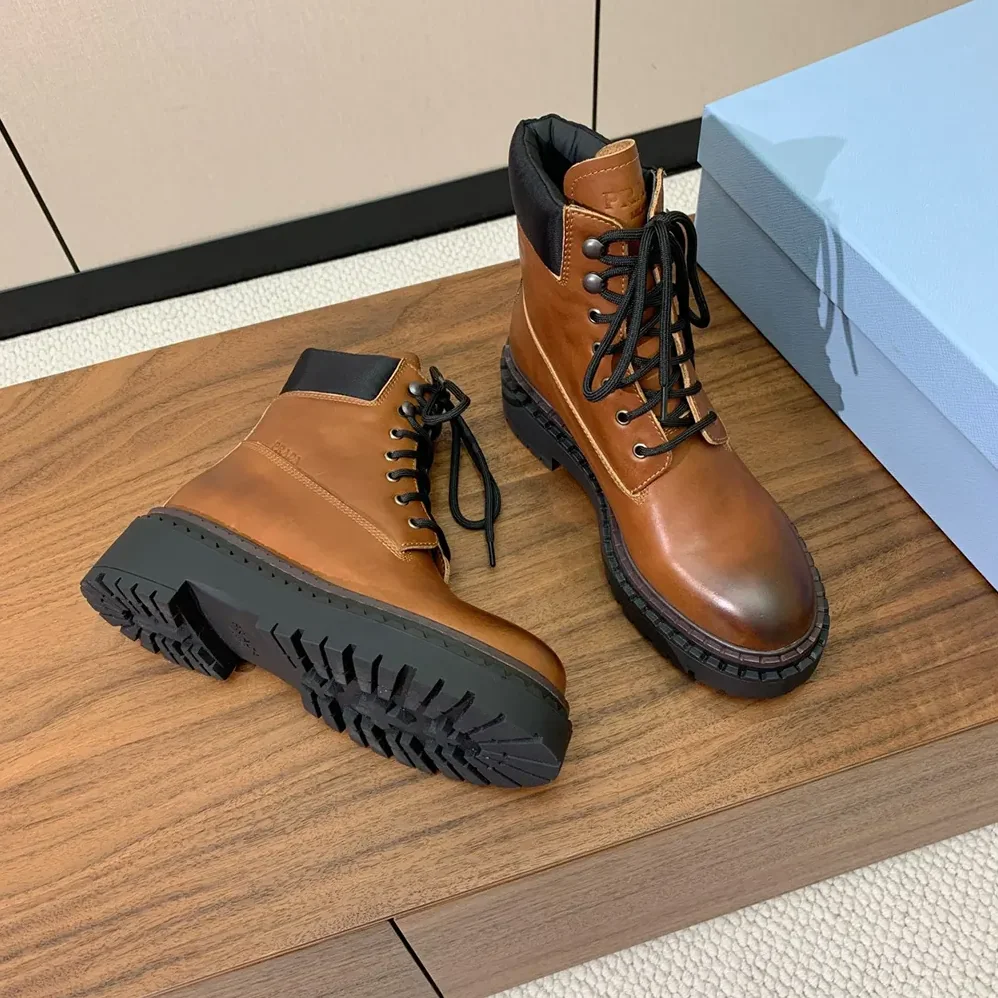 Prada Leather and Re-Nylon booties for Unisex in Ebony
