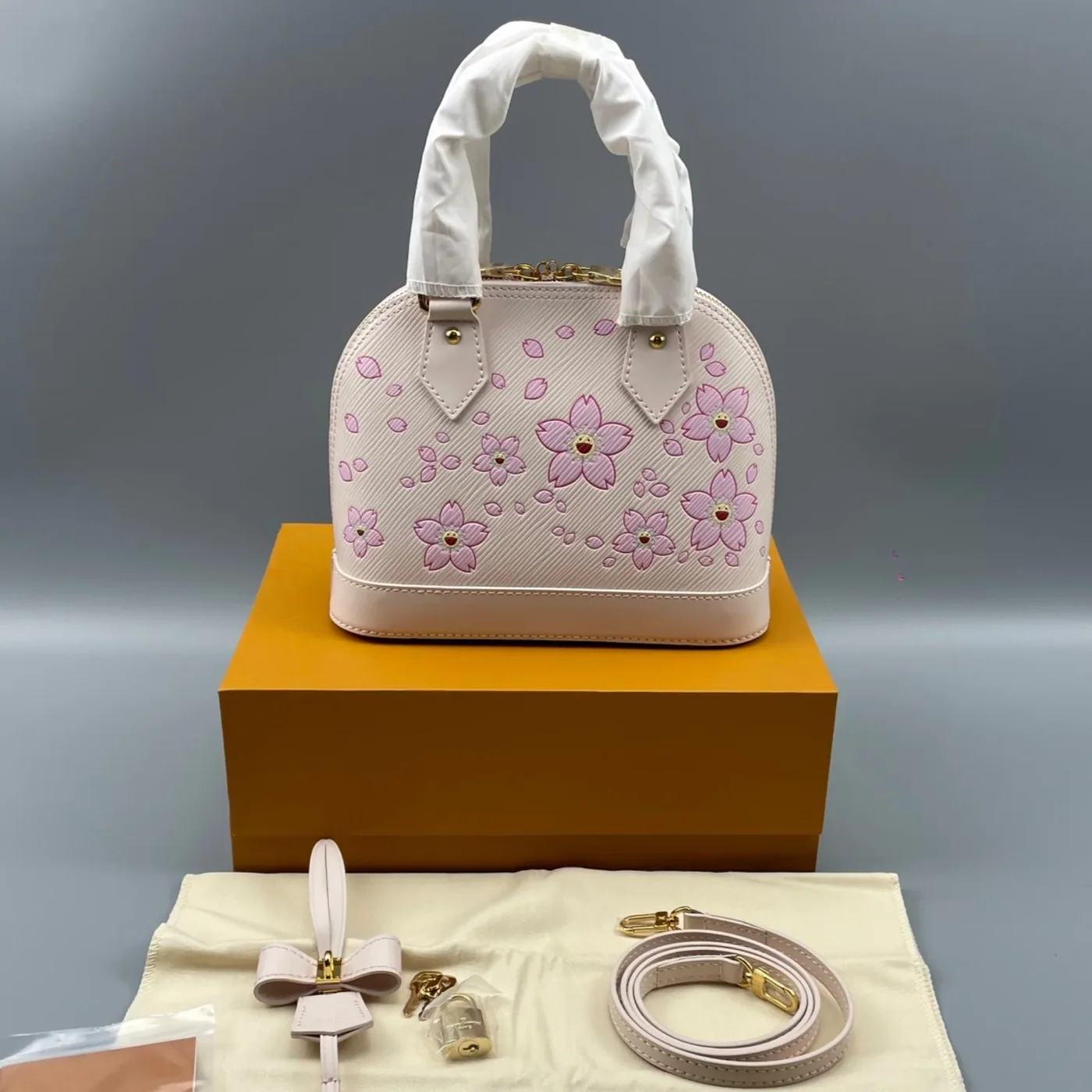 Louis Vuitton LV x TM Alma BB Top Handle Bag in Pink Gold Hardware