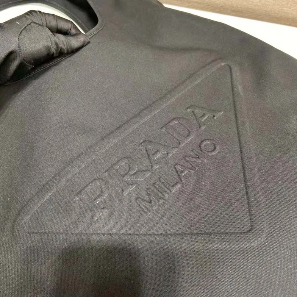 Prada Canvas Hobo Bag with Embossed Logo on the Front for Men in Black Prada Canvas Hobo Bag with Embossed Logo on the Front for Men in Black