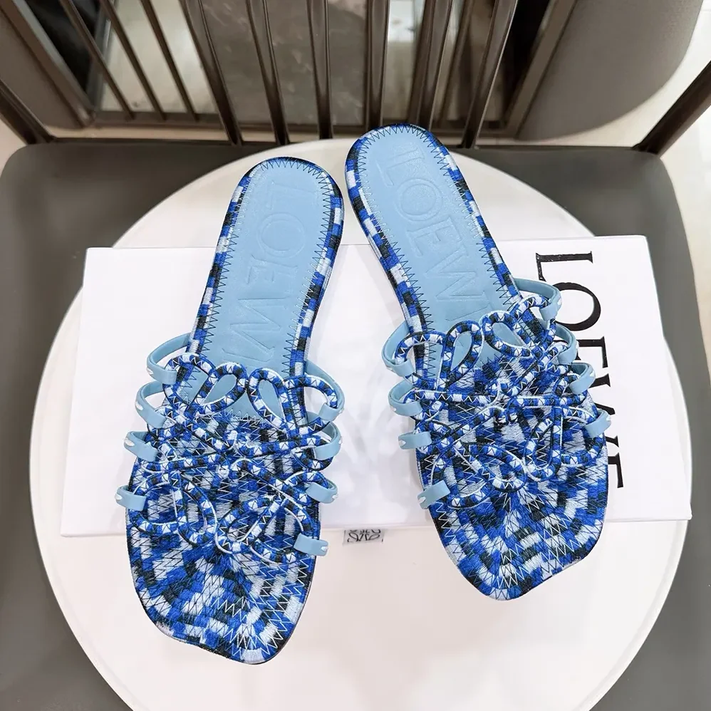 Loewe Petal Anagram Slide in Embroidered Canvas for Women in Baby Blue Loewe Petal Anagram Slide in Embroidered Canvas for Women in Baby Blue