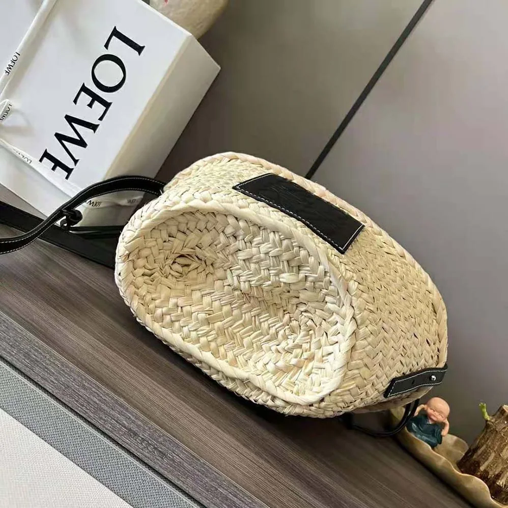 Loewe Drawstring Bucket Bag in Palm Leaf and Calfskin for Women in Black