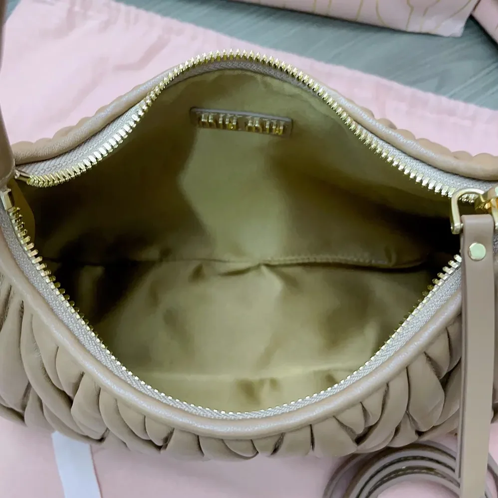Miu Miu Wander Matelassé Nappa Leather Hobo Bag for Women in Caramel Miu Miu Wander Matelassé Nappa Leather Hobo Bag for Women in Caramel