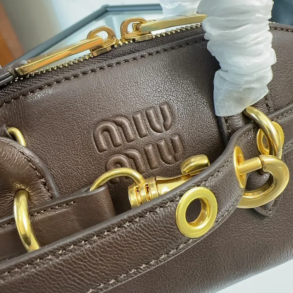 Miu Miu Aventure Nappa Leather Top-handle Bag for Women in Bordeaux Miu Miu Aventure Nappa Leather Top-handle Bag for Women in Bordeaux