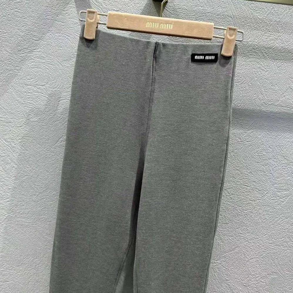 Miu Miu Silk Jersey Pants with Logo Patch for Women in Gray