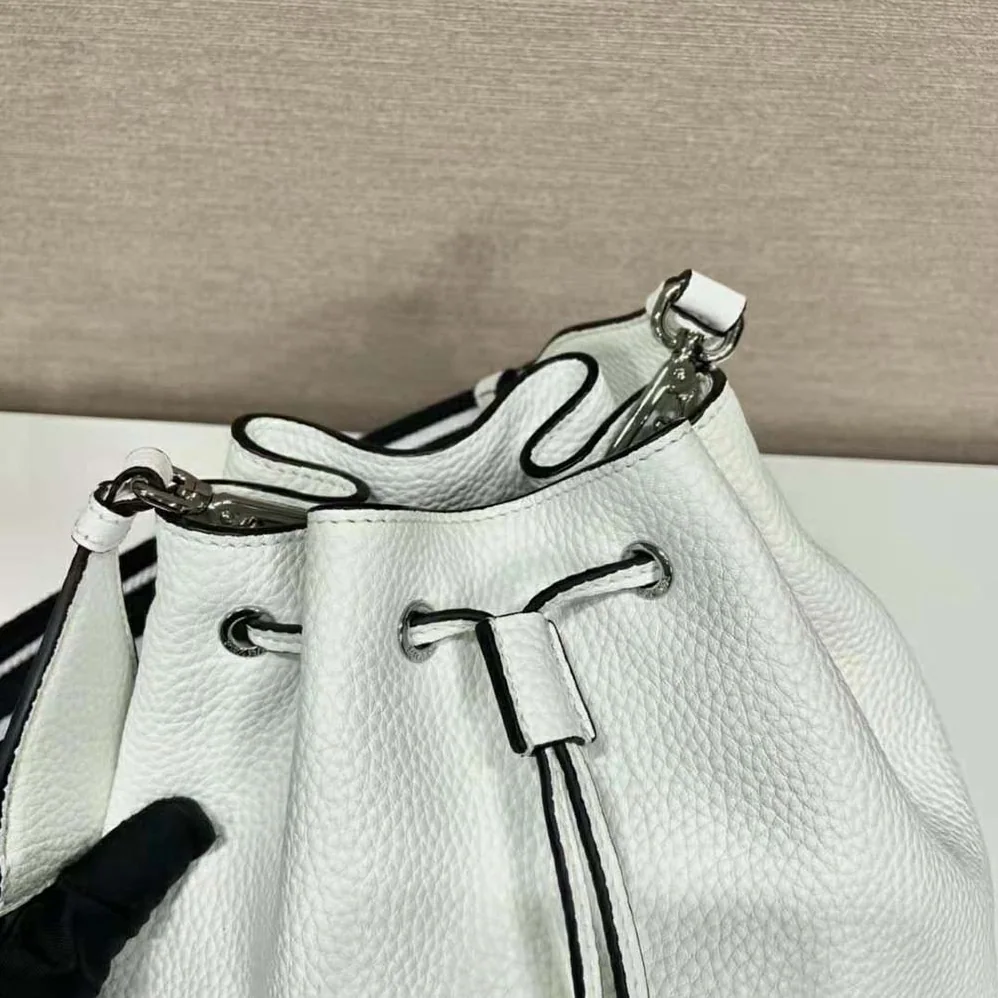 Prada Leather Bucket Bag with A Soft Silhouette for Women in White Prada Leather Bucket Bag with A Soft Silhouette for Women in White