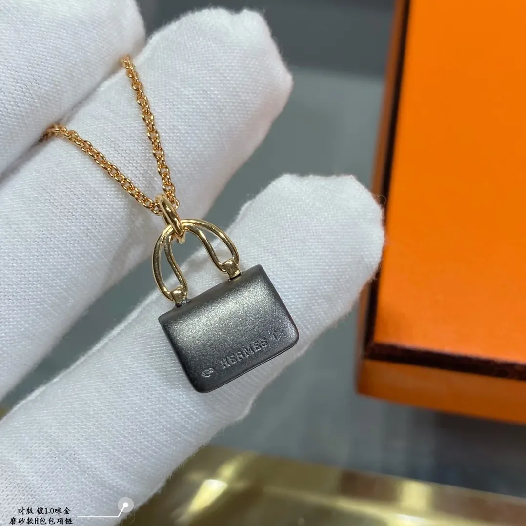 Hermes Constance Amulets Pendant Necklace Gold Tone Hermes Constance Amulets Pendant Necklace Gold Tone