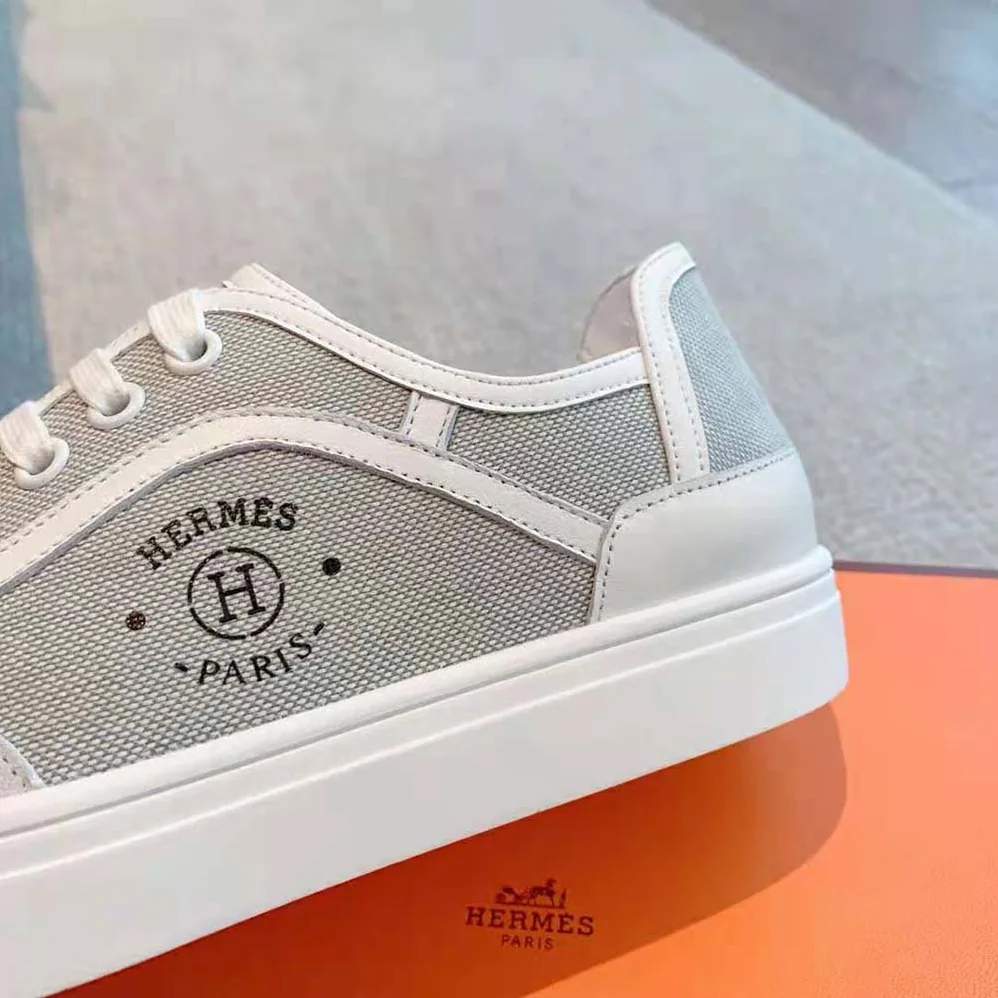 Hermes Get Sneaker in SH Canvas and Calfskin with Signature “Hermès Paris” Stencil for Unisex in Silver Hermes Get Sneaker in SH Canvas and Calfskin with Signature “Hermès Paris” Stencil for Unisex in Silver