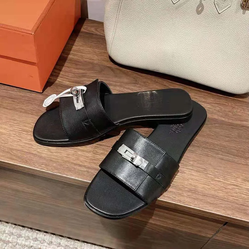 Hermes Giulia Sandal in Calfskin with Iconic Palladium-Plated Kelly Buckle for Women in Black Hermes Giulia Sandal in Calfskin with Iconic Palladium-Plated Kelly Buckle for Women in Black