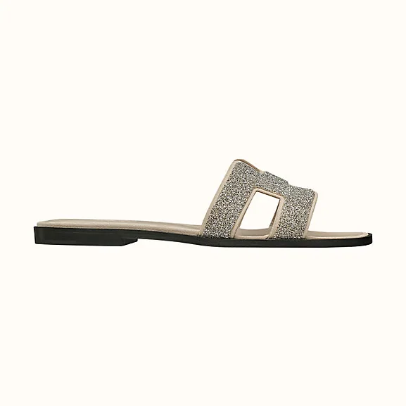 Hermes Oran Sandal Hermes Sandal in Metallic Nappa Leather and Cristal Powder for Women in Sandy