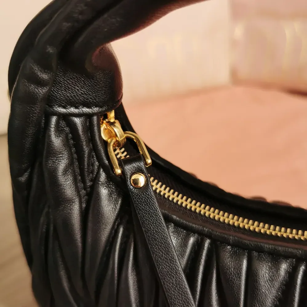 Miu Miu Wander Matelassé Nappa Leather Hobo Mini-Bag for Women in Black Miu Miu Wander Matelassé Nappa Leather Hobo Mini-Bag for Women in Black