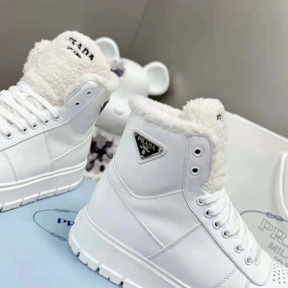 Prada Leather and Shearling High-Top Sneakers for Women in White Prada Leather and Shearling High-Top Sneakers for Women in White