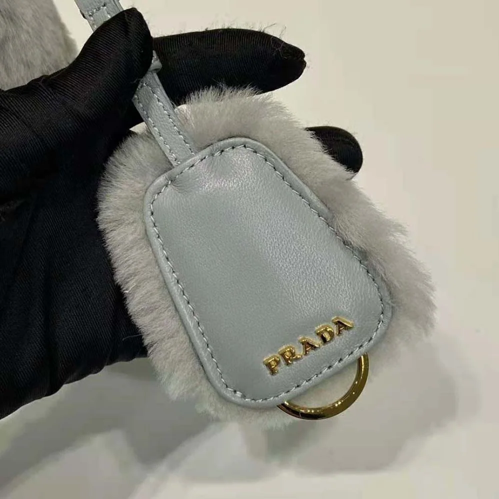 Prada Shearling Mini-Bag with the Enameled Metal Triangle Logo for Women in Silver